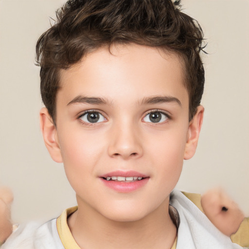 Joyful white child male with short  brown hair and brown eyes