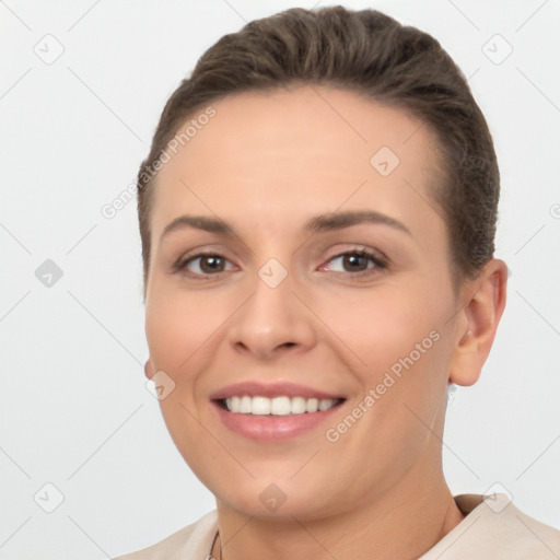 Joyful white young-adult female with short  brown hair and brown eyes