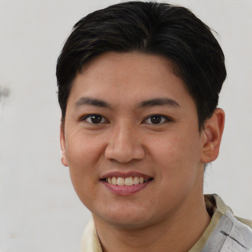 Joyful asian young-adult female with short  brown hair and brown eyes