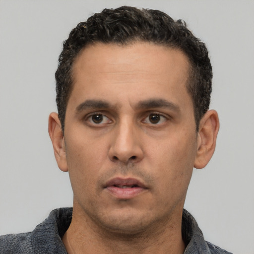 Neutral white young-adult male with short  black hair and brown eyes