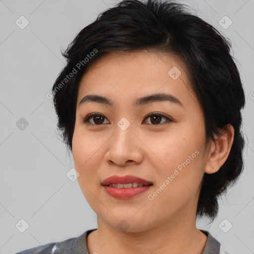 Joyful asian young-adult female with medium  black hair and brown eyes