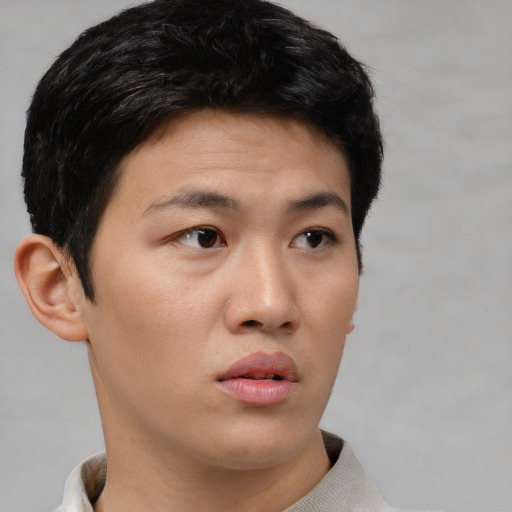Neutral asian young-adult male with short  black hair and brown eyes