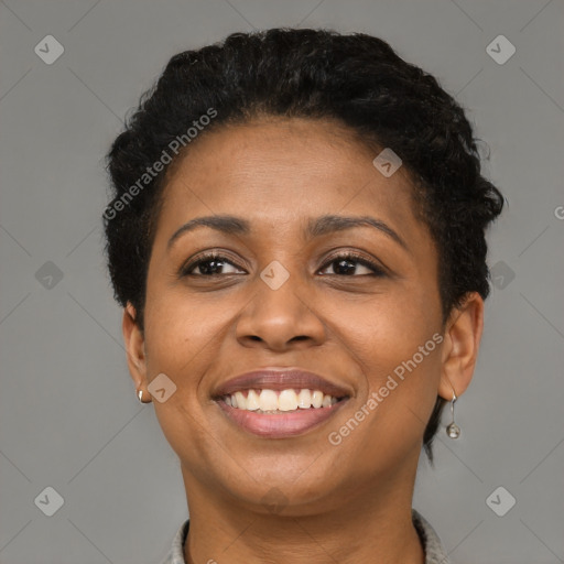 Joyful black young-adult female with short  brown hair and brown eyes