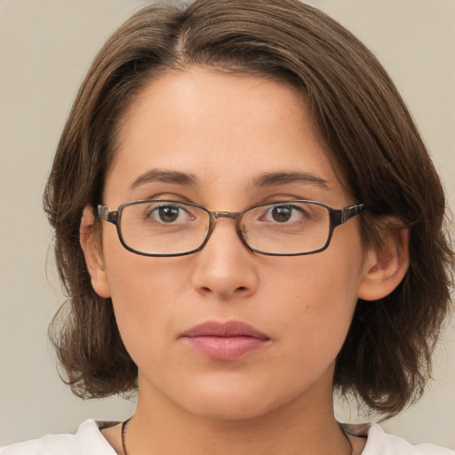 Neutral white young-adult female with medium  brown hair and brown eyes