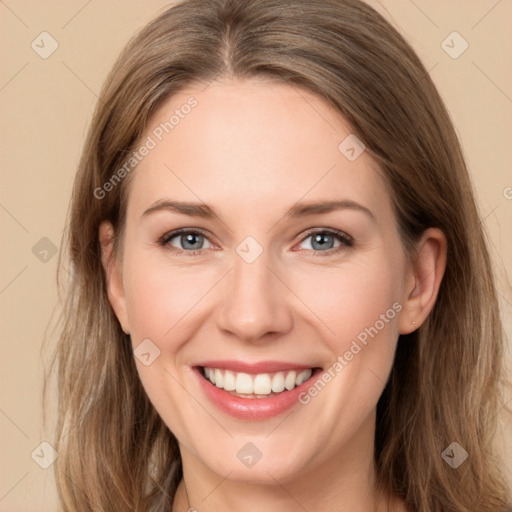 Joyful white young-adult female with long  brown hair and grey eyes