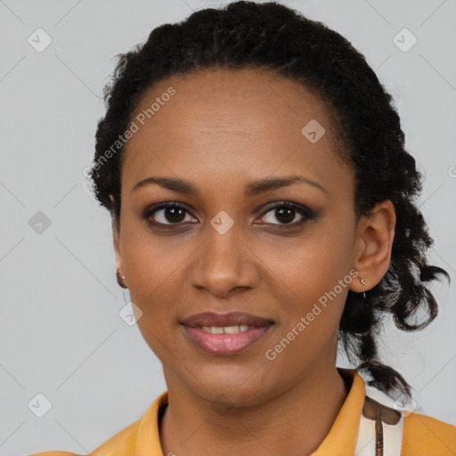 Joyful black young-adult female with long  black hair and brown eyes