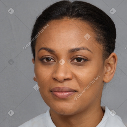 Joyful black young-adult female with short  black hair and brown eyes