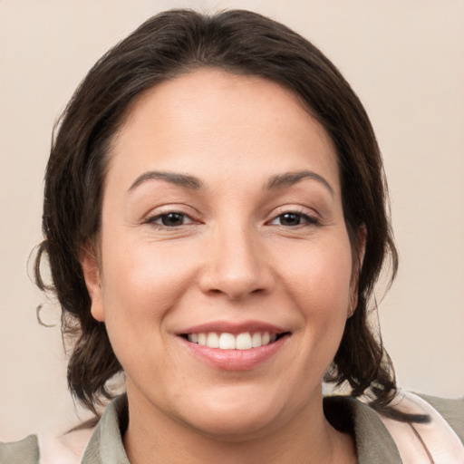 Joyful white young-adult female with medium  brown hair and brown eyes