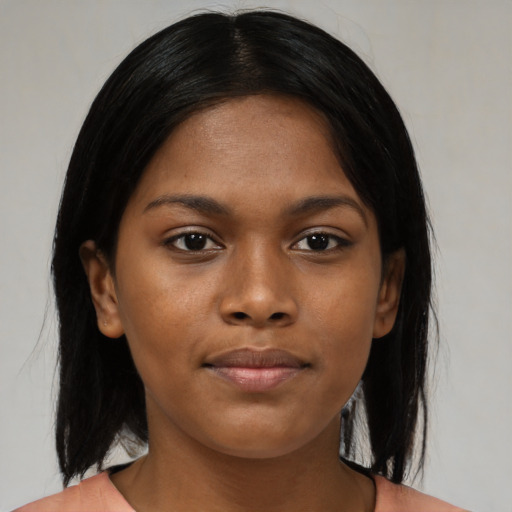 Neutral black young-adult female with medium  black hair and brown eyes