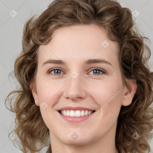 Joyful white young-adult female with medium  brown hair and green eyes