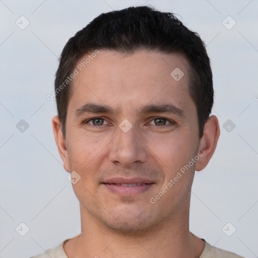 Joyful white young-adult male with short  brown hair and brown eyes