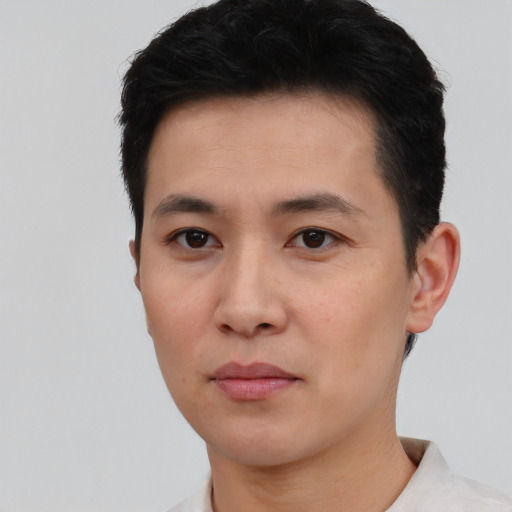 Neutral asian young-adult male with short  black hair and brown eyes
