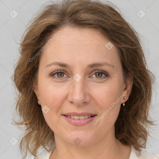 Joyful white adult female with medium  brown hair and grey eyes