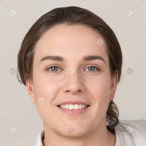 Joyful white young-adult female with short  brown hair and grey eyes