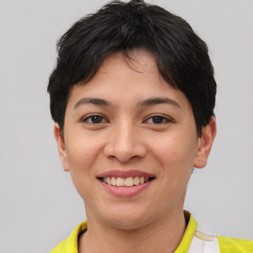 Joyful asian young-adult female with short  brown hair and brown eyes
