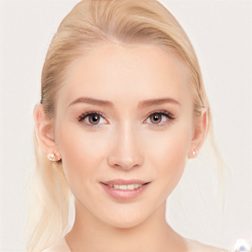 Joyful white young-adult female with medium  blond hair and brown eyes