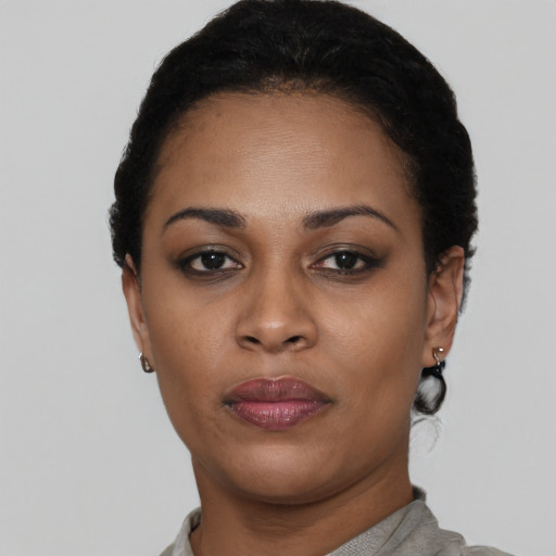 Neutral black young-adult female with short  black hair and brown eyes