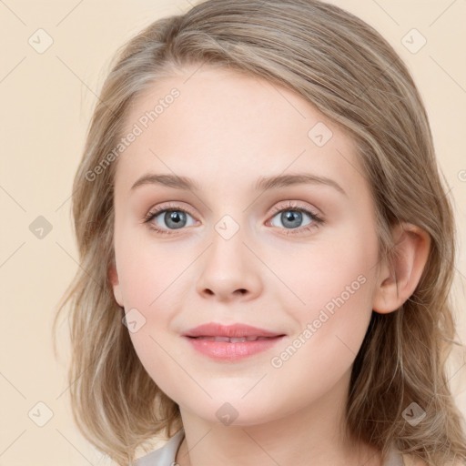 Joyful white young-adult female with medium  brown hair and blue eyes