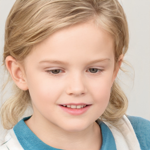 Joyful white child female with medium  brown hair and grey eyes