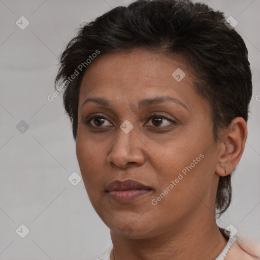 Joyful white adult female with short  brown hair and brown eyes