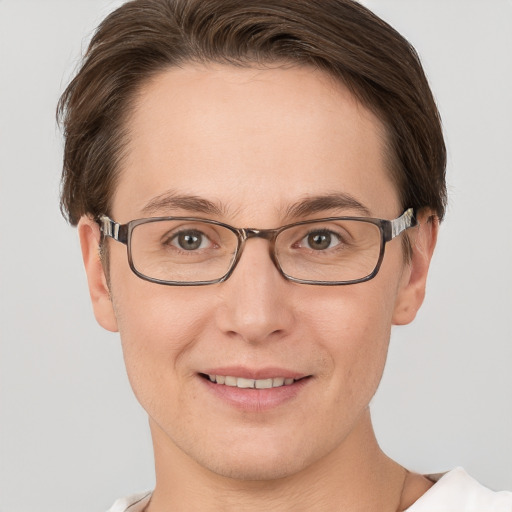 Joyful white adult female with short  brown hair and grey eyes