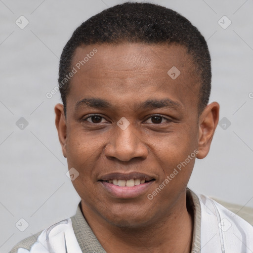 Joyful latino young-adult male with short  brown hair and brown eyes