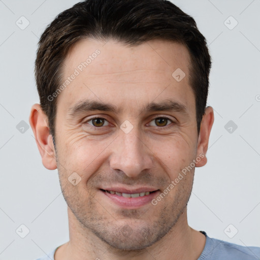 Joyful white adult male with short  brown hair and brown eyes