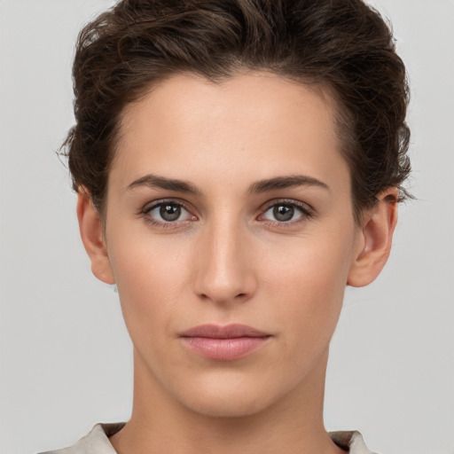 Neutral white young-adult female with short  brown hair and brown eyes