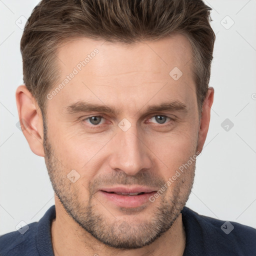 Joyful white adult male with short  brown hair and brown eyes