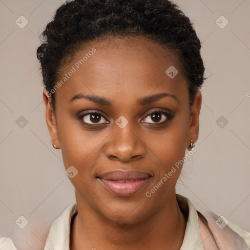 Joyful black young-adult female with short  black hair and brown eyes