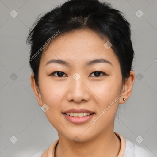 Joyful asian young-adult female with short  brown hair and brown eyes