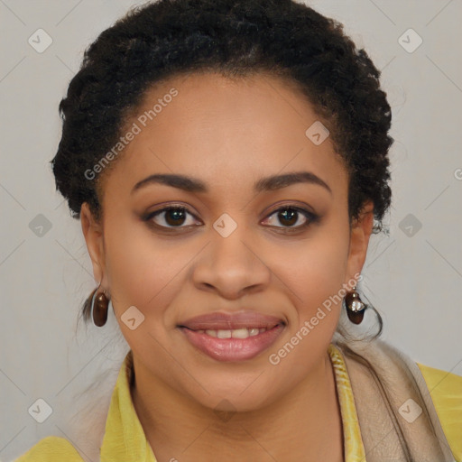 Joyful black young-adult female with long  brown hair and brown eyes