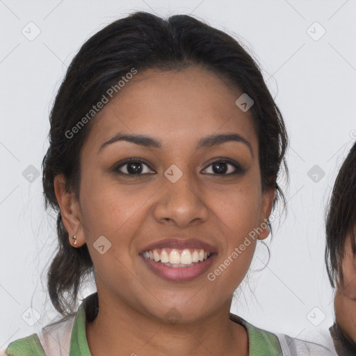 Joyful latino young-adult female with medium  brown hair and brown eyes