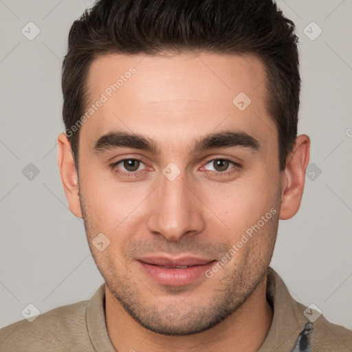 Joyful white young-adult male with short  brown hair and brown eyes