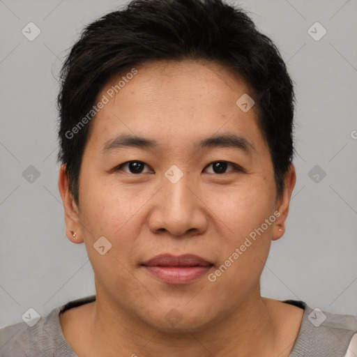 Joyful asian young-adult male with short  brown hair and brown eyes