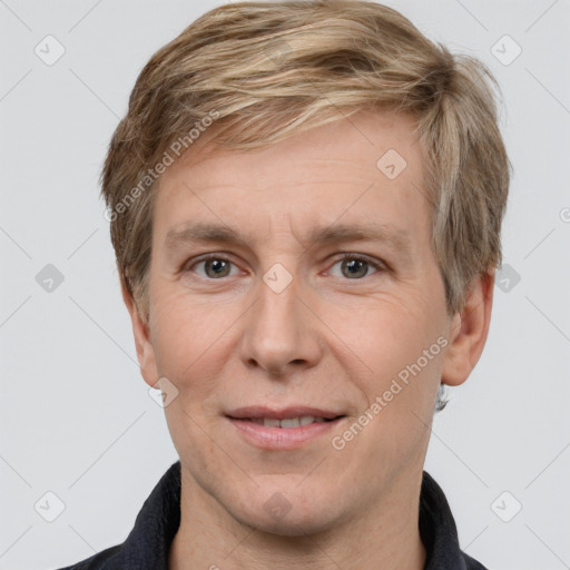 Joyful white adult male with short  brown hair and grey eyes