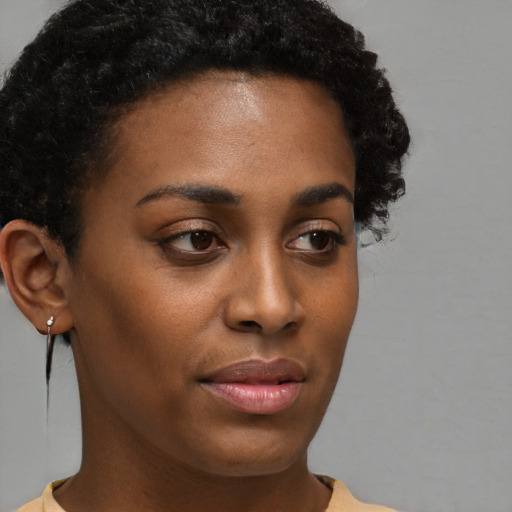 Neutral black young-adult female with short  brown hair and brown eyes