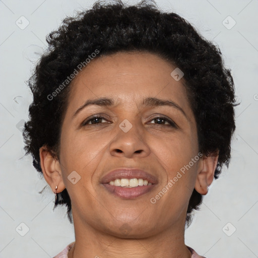 Joyful black adult female with short  brown hair and brown eyes