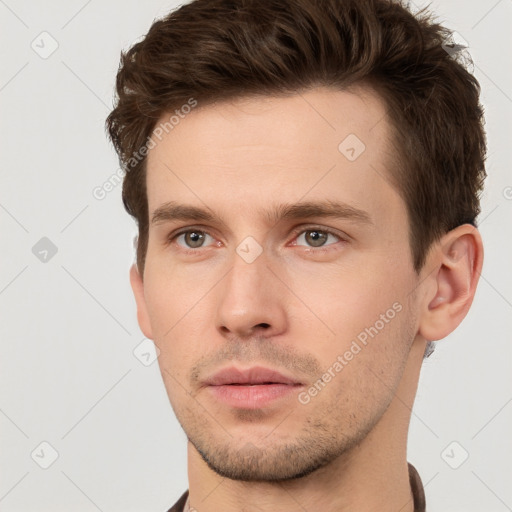 Neutral white young-adult male with short  brown hair and brown eyes