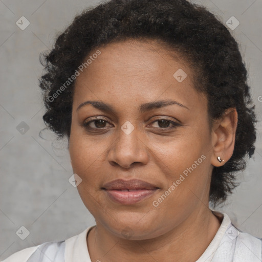 Joyful black adult female with short  brown hair and brown eyes