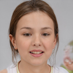 Joyful white child female with medium  brown hair and brown eyes