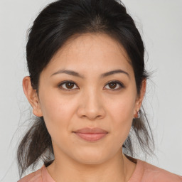 Joyful asian young-adult female with medium  brown hair and brown eyes