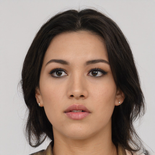 Neutral asian young-adult female with medium  brown hair and brown eyes