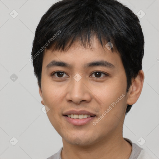 Joyful asian young-adult male with short  black hair and brown eyes