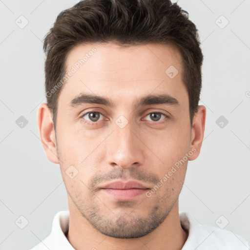 Neutral white young-adult male with short  brown hair and brown eyes