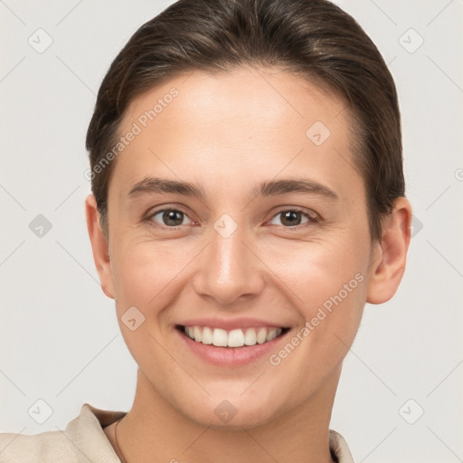 Joyful white young-adult female with short  brown hair and brown eyes