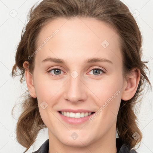 Joyful white young-adult female with medium  brown hair and blue eyes