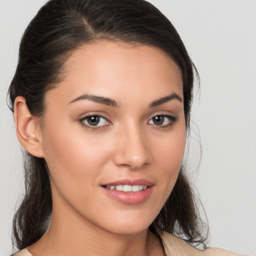 Joyful white young-adult female with medium  brown hair and brown eyes