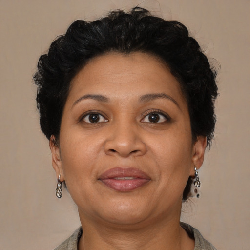 Joyful latino adult female with short  brown hair and brown eyes