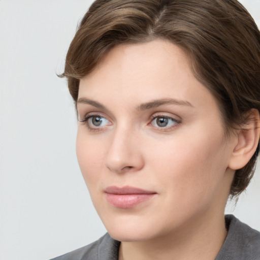 Neutral white young-adult female with medium  brown hair and grey eyes